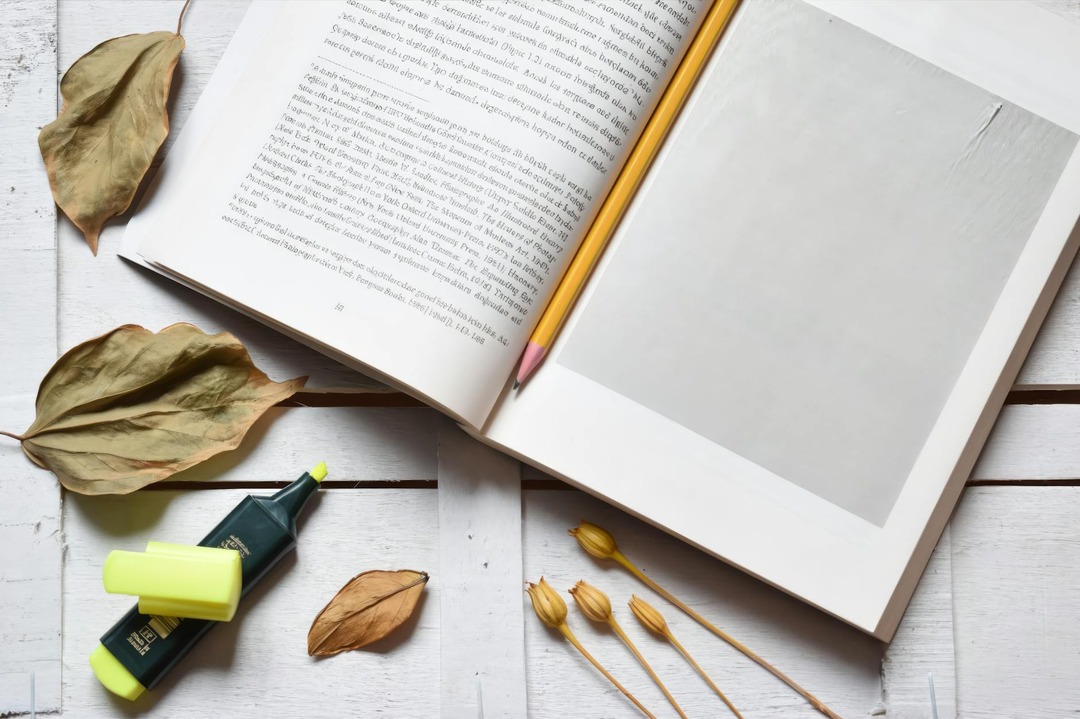Imprint Your Imagination: How Craft-Minded Book Lovers Turn Embossing into an Art Form Flat lay desk setup with notebook, pen and writing inspiration